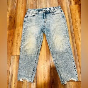 Women’s size 14 cropped acid washed jeans with ripped hems.